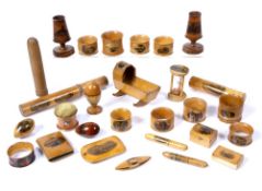 Collection of Mauchline ware to include: hourglass, pincushion, bobbins, thimble holders, candle