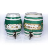 Two ceramic kegs with green and white striped decoration, 'P. Brandy' and 'Rum', both taps are
