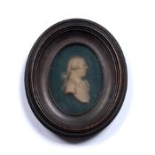 Oval wax miniature 19th Century, depicting a bewigged gentleman, in original frame and with