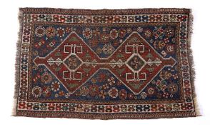 Caucasian blue ground rug with red ground central double medallion, and with stylised foliate