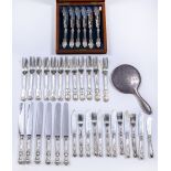 Collection of silver cutlery to include: set of six Victorian silver forks with engraved castle