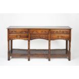 Oak dresser base 18th Century, fitted drawers with brass handles and with pot board below, 165cm