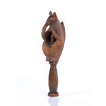Victorian treen nutcracker in the form of a squirrel holding a nut, 15cm approx overall Condition: