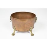 Copper and brass log bin with lion mask handles, standing on paw feet, 38cm x 30cm Condition: at