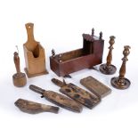 Collection of treen including: carved biscuit moulds, pair of candlesticks, dolls cot, candlebox etc