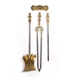 Set of fire irons with brass handles, longest measures 67.5cm overall and a door stop (4) Condition: