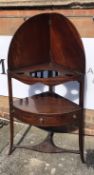 Mahogany corner wash stand 19th Century, with recessed top and folding cover, fitted drawer to the
