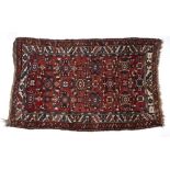Caucasian red ground rug with foliate medallions and foliate and geometric multiple border, 124cm