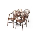 Set of four yew and elm wheel-back Windsor elbow chairs George III, each with three rail back and