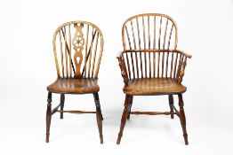 Yew-wood and elm Windsor chair 19th Century, with arched stick-back and solid seat, 57cm across,