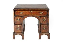 Walnut and herring-bone inlaid kneehole desk 18th Century, fitted one long and four smaller
