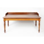 Large mahogany writing/library table 19th Century, having a raised back on turned supports, 158cm