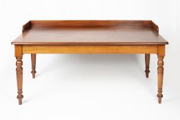 Large mahogany writing/library table 19th Century, having a raised back on turned supports, 158cm