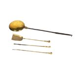 Engraved brass and iron warming pan 18th Century, 118cm long and three brass fire irons Condition: