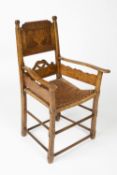 Elm and fruitwood elbow chair Scandinavian, with rush seat and inlaid back panel inscribed Mette