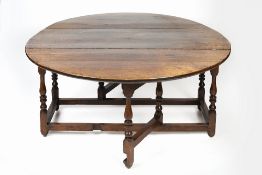 Large oak gate-leg dining table 18th Century, with two drop leaves and turned supports, 154cm