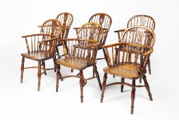 Near set of six yew-wood and elm Windsor elbow chairs 19th Century, each with pierced splat back,
