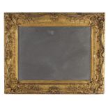 A 19TH CENTURY GILT GESSO FRAME of swept rococo form moulded with 'C' scrolls and flowering foliage,