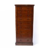 A VICTORIAN MAHOGANY WELLINGTON CHEST, having nine drawers, with locking stile, on plinth base, 65.