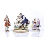 A CONTINENTAL PORCELAIN FIGURE GROUP, of a courting couple, on gilt heightened oval base, 18cm high;