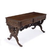 A CEYLONESE ROSEWOOD RECTANGULAR CENTRE TABLE with two frieze drawers, the drawers and frieze carved