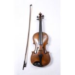 A LATE 19TH CENTURY GERMAN VIOLIN with two piece back, back length 36cm; with German bow, in