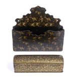 A 19TH CENTURY PERSIAN PEN BOX with domed cover and all over gilt foliate decoration, 26cm wide