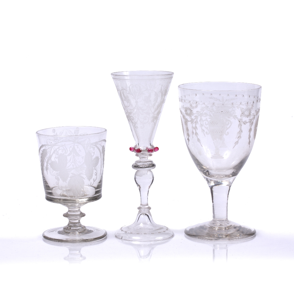 THREE ANTIQUE DRINKING GLASSES, the large glass decorated with an OXO border, the bowl engraved with