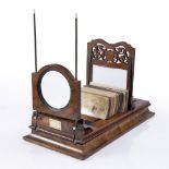 A VICTORIAN FIGURED WALNUT TABLE TOP STEREOSCOPIC VIEWER by Negretti & Zambra, London,58cm long,