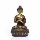 A NEPALESE GILT AND PATINATED BRONZE BUDDHA with original seal mark to base, 19th Century, 30cm