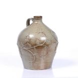 A SALT GLAZED STONEWARE FLAGON relief decorated with trailing scroll oak leaf and branch decoration,