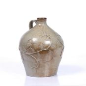A SALT GLAZED STONEWARE FLAGON relief decorated with trailing scroll oak leaf and branch decoration,