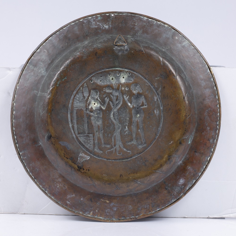 A NUREMBERG BRASS ALMS DISH the centre roundel embossed with Adam and Eve and serpent, Germany - Image 2 of 2