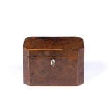 A GEORGE III BURR YEW TEA CADDY of rectangular form with canted corners, hinged lid and twin