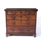 A GEORGE III MAHOGANY BACHELOR'S CHEST, with hinged fold over top above four long graduated drawers,