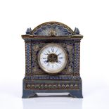 A LATE 19TH CENTURY DOULTON LAMBETH CASED MANTEL CLOCK the convex white enamel dial with blue