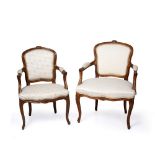 A FRENCH HEPPLEWHITE STYLE BEECHWOOD AND UPHOLSTERED ELBOW CHAIR, the cresting rail carved with