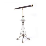 A VICTORIAN LEATHER AND BRASS TELESCOPE with single telescopic draw adjusting by a collar, upon a