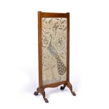 AN EDWARDIAN MAHOGANY AND STRING INLAID CHEVAL SCREEN, inset with silk panel embroidered with