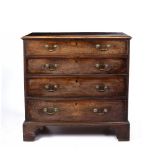 A GEORGE III MAHOGANY CHEST, the top with a moulded edge above four graduated long drawers, ogee