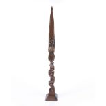 A HARDWOOD STAFF FINIAL, possibly Polynesian carved as a female torso to a barbed type waved design,