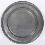 AN 18TH CENTURY PEWTER WRIGGLEWORK CHARGER decorated with fishermen on the banks of a river, and