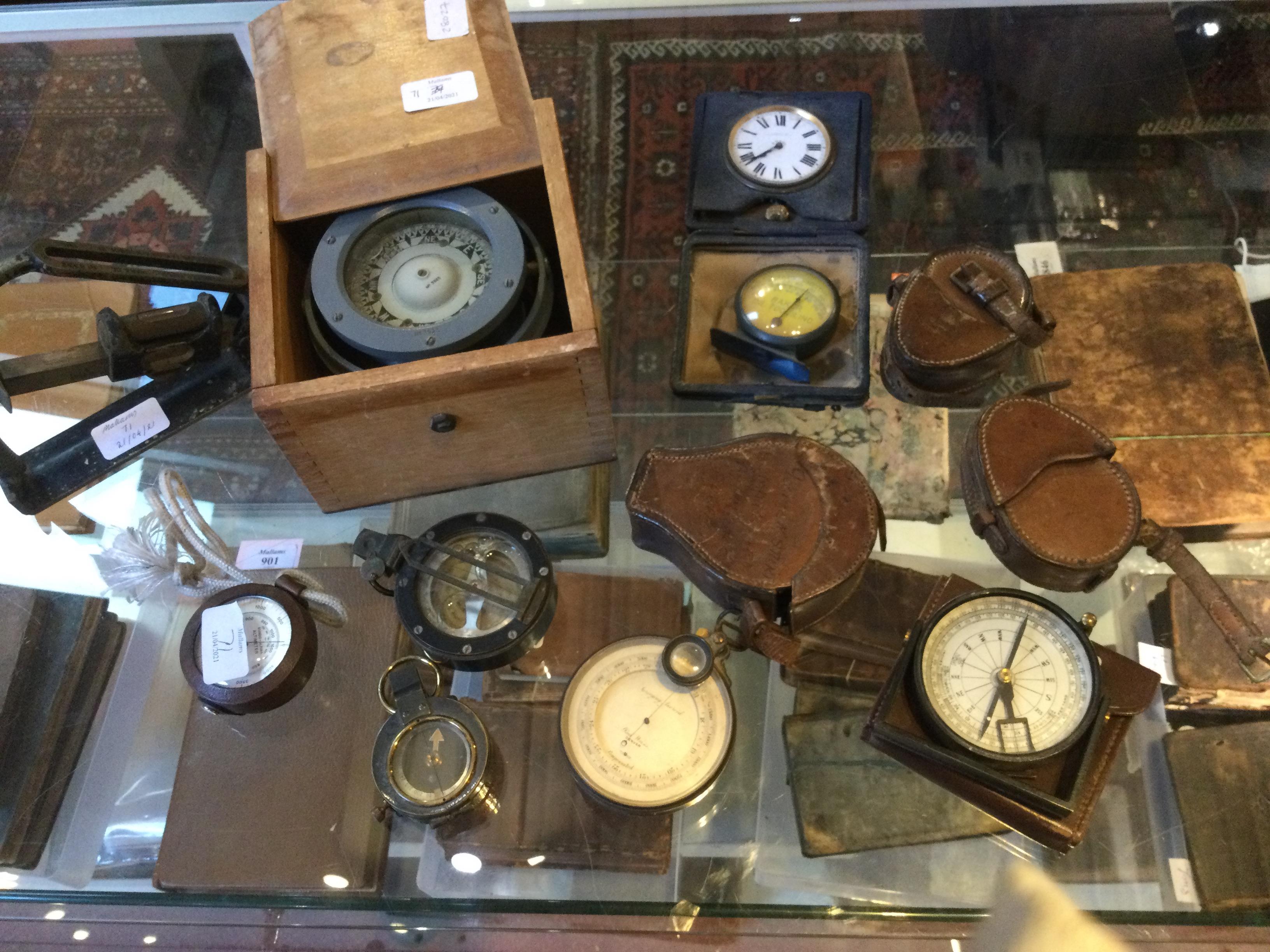 AN OLD EBONISED AND BRASS CASED POCKET ALTIMETER/BAROMETER, the silvered dial engraved 'Paul