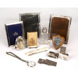 A group of four silver mounted photograph frames, together with a white metal pocket watch, two