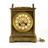 An antique French brass mantle clock with a mercury barometer dial, the enamelled and gilded clock