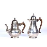 A 20th century silver teapot and matching hot water jug each with marks for London 1945, the