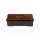 A late 19th century Swiss made cylinder music box with a satinwood inlaid and ebonised case, 43cm