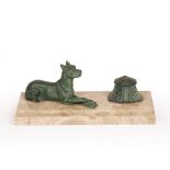 A desk stand, the marble base mounted with a bronze coloured cast metal hound and inkwell, 30cm