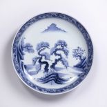 Blue and white plate Japanese, (Edo period) decorated to the centre depicting a rocky outcrop with