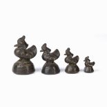 Four graduated bronze opium weights Nepalese each in the form of a duck, largest 6.25cm Condition:
